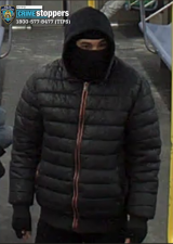 Surveillance photo of suspect on J train. Note “shiesty mask.”