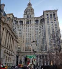 A 19 -year-old outside the New York State municipal court building at 1 Center St. One person was stabbed in the neck in an apparent random attack shortly before noon on Oct. 16. Police arrested a 51-year-old ex-con from Harlem later that day and charged him with attempted murder.