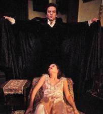 Actor Christopher Bernau as Dracula hovers over actress Giulia Pagan in the 1977 production of<i>“The Passion of Dracula”</i> at the Cherry Lane Theater. In Medieval Europe, there was a belief that the scent of garlic repelled vampires. Modern science has found many other new benefits. Photo: Bernard Gotfryd/Wikimedia Commons