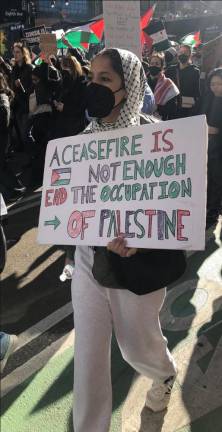 <b>As the parade winds down, several hundred pro Palestine demonstrators march up Eighth Ave. and end up throwing fake blood and scrawling graffiti on the walls of the New York Public Library.</b> Photo: Keith J. Kelly