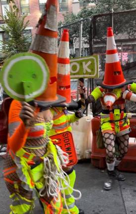 Some people in the Greenwich Village got into the Halloween spirit early in the on Oct. 19, dressed as traffic stopping traffic cones. The parade in that neighborhood on Oct. 31 is billed as the largest Halloween parade in the country.