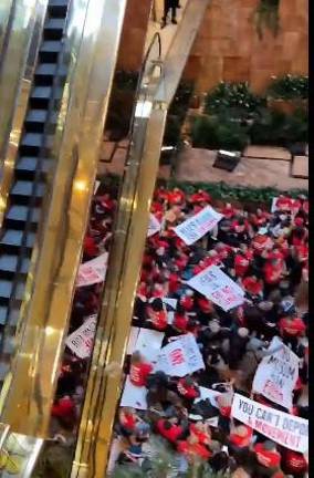 Close to 100 people were arrested inside Trump Tower on March 13.