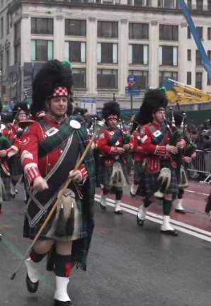 The FDNY Emerald Scciety Pipes &amp; Drums heads up Fifth Ave. on March 17.