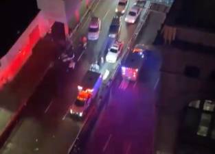 Aerial photo of the scene near E. 75th St. on the FDR Drive where a Tesla being driven by an unidentified woman slammed into a wall and ejected her and her 25 year old male passenger. She was pronounced dead at the scene while the passenger was transported to Weill Cornell Hospital.