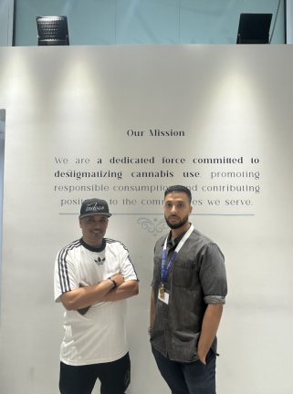 <b>Co-owners Fikri Nagi (left) and Wesim Alsaidi (right) pose in front of Indoor Treez’s mission statement written on the wall, reading: “We are a dedicated force committed to destigmatizing cannabis use, promoting responsible consumption, and contributing positivity to the communities we serve.</b>”