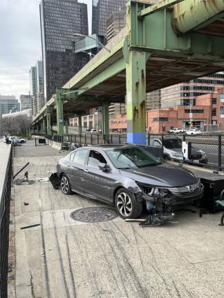 A car crashed onto the East River Esplanade early in the morning of Sunday, February 19th. Although one officer on the scene said he suspected the driver was “probably intoxicated,” no arrests were made. Photo: Kevin J. Kelly.