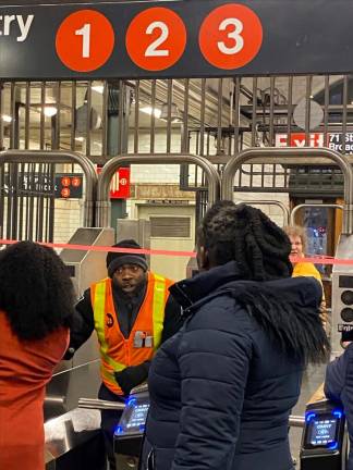 Customers at the W. 72 station hear that the 1,2 and 3 trains were halted in both directions due to a train derailment at the 96th St. station shortly after 3 p.m. on Jan. 4. Photo: Michael Oreskes