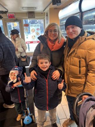 Benjamin Bourgaput (top right) and his wife Anne Bourgaput (top left) were visiting from France and spotted the bakery in the West Village for the first. They were attracted to they said because it is a well know quality chain in France.