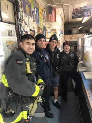 Firefighters from a nearby station house stopped by Ray’s Candy Store for morning coffee as a show of support following the Jan. ‘23 assault by two thugs. Photo: Keith J. Kelly