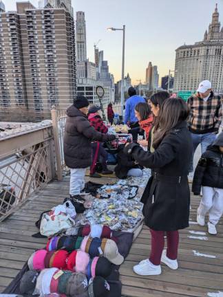 Dozens of Illegal Vendors— &amp; One Giant Ape—Reclaim Brooklyn Bridge from City