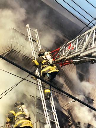 Photo of Andy Serra battling a blaze on Staten Island early in his firefighter career.