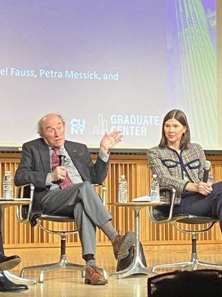 Professor Robert Paaswell of CCNY, a transit expert, speaks at City Club forum as Petra Messick of Amtrak listens.