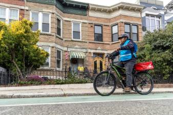 Applications are now being accepted for a DOT program that will allow delivery drivers–such as the one pictured above–to trade in unregulated e-bikes for safe, UL-approved ones.