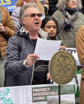 Local advocate and founder of Save Inwood Hill Park, Massimo Strino, speaks at the Feb. 27 rally on the steps of City Hall. “There is no place for plastic grass in our parks,” Strino said. Beyond Plastic’s Nyah Estevez stands behind Strino.