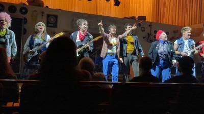 <b>“Good Vibrations” about the punk rock scene in Belfast during the height of The Troubles is based on a true story. Here the Undertones a Belfast band fronted by Feargal Sharkey (played by Dylan Reid, center) belts out a tune that raises the roof at the Irish Arts Center. </b>Photo: Susie Davidson