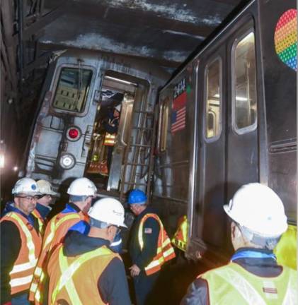 MTA workers at the scene where two subway cars derailed at the W. 96th St. station on Jan. 4.