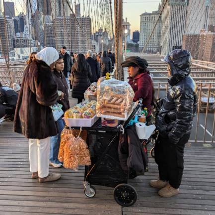 Dozens of Illegal Vendors— &amp; One Giant Ape—Reclaim Brooklyn Bridge from City