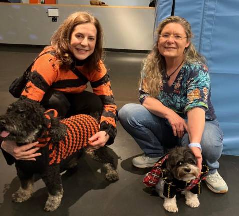 Lisa Malloy (left) and Carine Vermono and their “paw-some” pups.