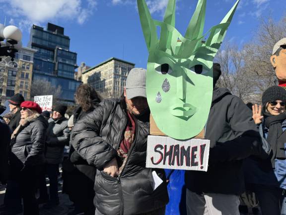 A protestor in Union Square with a sign reading “Shame!” beneath a crying image of the Statue of Liberty. The sentiment of anger and frustration towards Donald Trump’s administration and Elon Musk’s policy changes was strongly felt among the many hundreds of protestors.