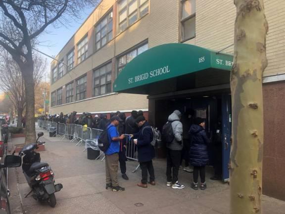 St. Brigid’s School, a shut-down Catholic elementary school in the East Village, drew long lines of asylum-seekers after the city used it as a processing center for people who exceeded 30 or 60 day shelter limits–and were seeking new placements.