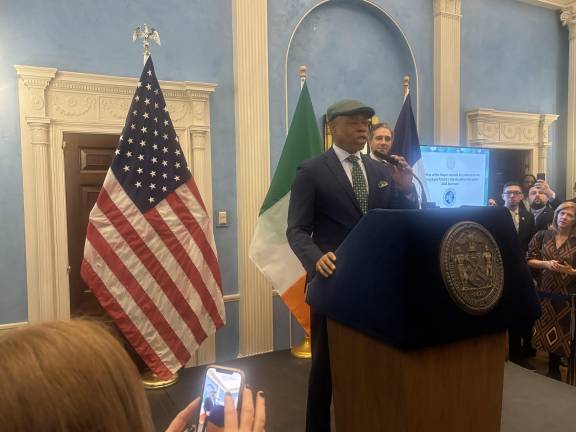 Mayor Eric Adams, wearing an Irish “scoop” cap and a green tie at the annual Gracie Mansion breakfast to start the day. But he skipped the traditional St. Patrick’s Day Mass to huddle with top aides.