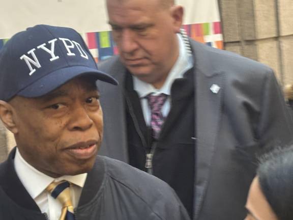 Mayor Eric Adams calls reporters “liars,” as he leaves a press conference at Bellevue Hospital Feb. 18 , where an NYPD office had been taken after getting shot. He refused to answer questions about his embattled administration, which saw four deputy mayors resign. Calls are growing for him to resign.