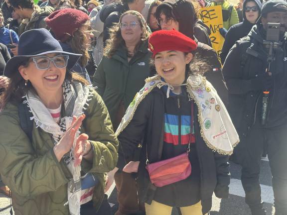 Elizabeth Payne (left) said she came to the anti-Musk rally because she did not want her daughter to one day ask her why she did not stand up for democracy. Her daughter, Avery Tsai, was there too and said, “I’m here to stand against fascism.”