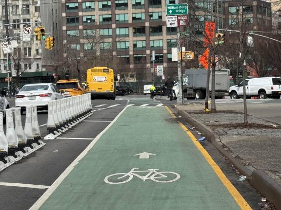 Near the intersection of 6th Avenue and Canal Street, broader and more protected lanes have been put in place by the NYC Department of Transportation.