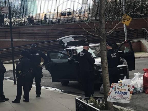 Police surround a car where a 35 year old woman died of a suspected suicide using a deadly mixture of a gas concocted from common household ingredients. Police found a 5 gal drum inside the car of the woman who sources said lived on Spruce St. in downtown Manhattan. Photo: Keith J. Kelly