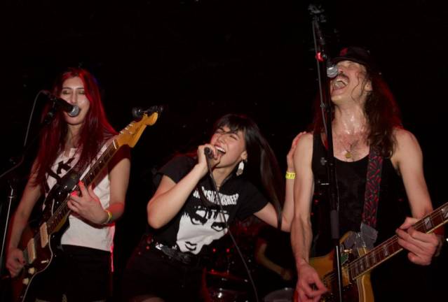 Puzzled Panther performs at benefit show for Ukraine on February 24th. Left to right: Kay Bontempo, Victoria Espinoza, and Eugene Hütz. Photo: Gina Vaccaro.