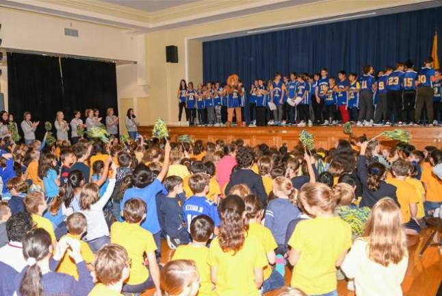 Students at a pep rally celebrating the start of the school year at St. Ignatius Loyola School.