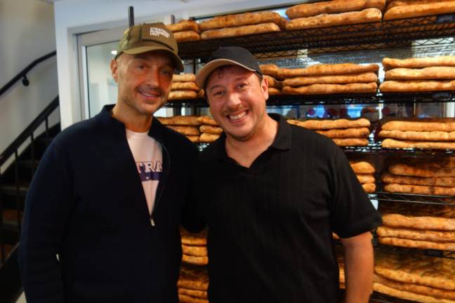 Joe Bastianich and Tommaso Mazzanti in front of oven-baked schiacciata.