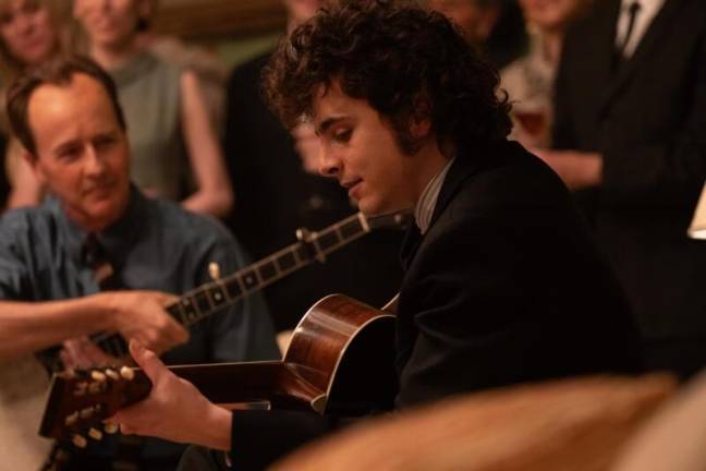 Edward Norton (left), who plays folk singer Pete Seeger, and Timothée Chalamet as Bob Dylan in “<i>A Complete Unknown” </i>which hits theaters on Dec. 25.