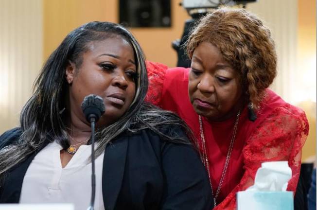 Defamed Georgia election worker Wandrea “Shaye” Moss (left), is comforted by her mother Ruby Freeman at a hearing before the the House select committee on June 21, 2022 investigating the Jan. 6, 2021 attack on the U.S. Capitol, The duo won, but has been unable to collect, a $148 million defamation verdict against Rudy Giuliani for false and defamatory comments about he made regarding the 2020 election.