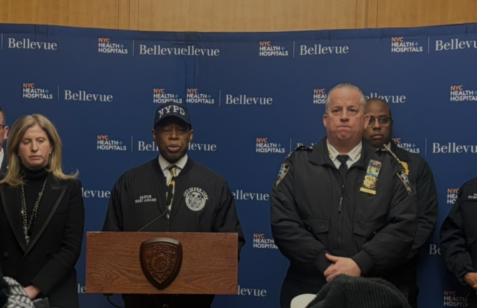 Mayor Eric Adams (center) and Police Commissioner Jessica Tisch (left) provide an update on an NYPD officer who was shot in the left shoulder during a press conference where the officer was rushed after the shooting. He was in stable condition. The suspect was in the same hospital after getting shot by cops but was listed as “not likely” to die.