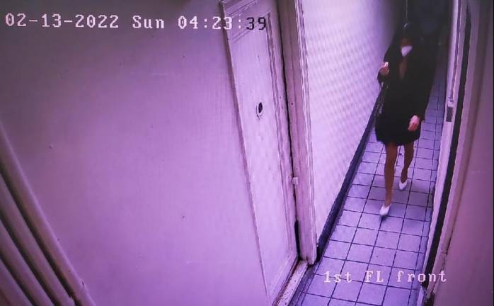 Surveillance camera at 111 Chrystie Street shows Christina Lee entering the first floor of her building.