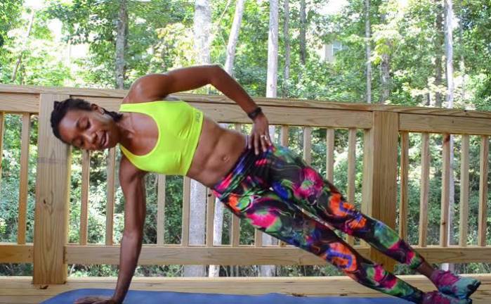 Young woman exercising at home