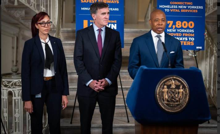 Mayor Eric Adams (at mic) introduces his new deputy mayor for public safety Chauncey Parker (center) who had been next in line to the recently resigned Phil Banks. Mona Suazo (far left) who was already in the public safety office was promoted to be Parker’s assistant.