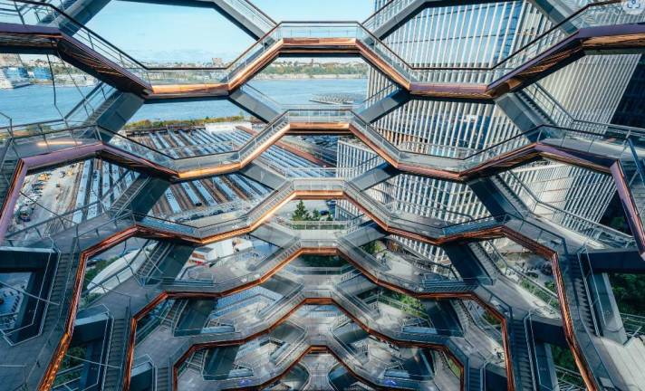 The Vessel now has steelmesh netting encasing it, barely visible from afar, which is designed to prevent any visitor from taking their own life by leaping off the structure. But the upper level of the 150-ft tall structure is still closed to the public because the mesh netting could not be installed on the uppermost floors.