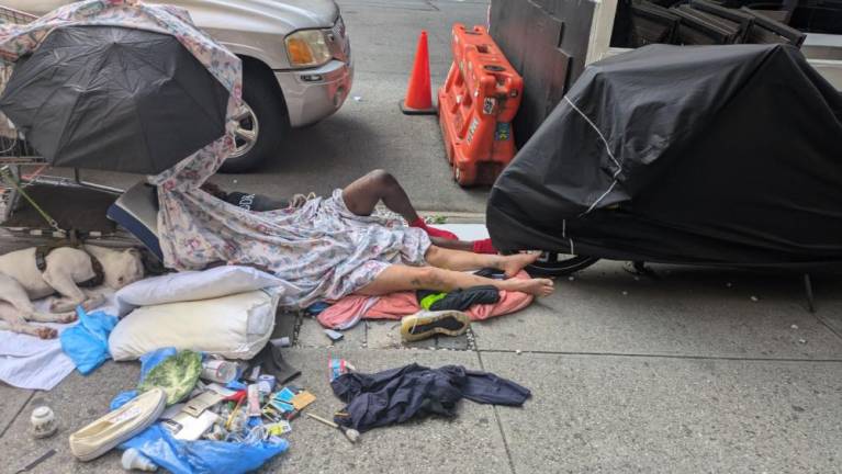 Woke Up It Was Chelsea Morning: A man, a woman and their dog living al fresco on 8th Avenue.