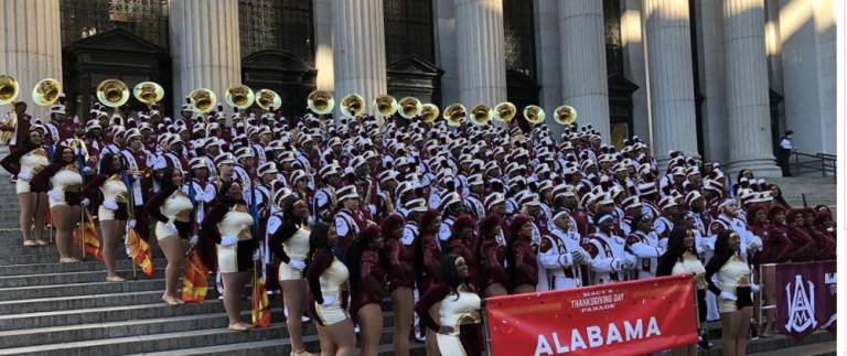 <b>The Alabama A&amp;M band head to the steps of the General Post Office on Eighth Ave. after marching in the 97th annual Macy’s Thanksgiving Day Parade and are photobombed by tourists.</b> Photo: Keith J. Kelly