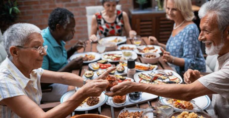 Making arrangements to dine together on a regular basis with other seniors can help combat isolation and loneliness. Photo: Boomershub