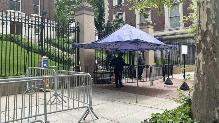 Police patrolling the area on Broadway avenue, between W 116th street and W 120th street under tents. The only entrance accessible to Columbia students that live on campus is the one on W 116th street, all other entrances are closed off. The university’s president requested police patrol the area until at least May 17th. Photo Credit: Alessia Girardin.