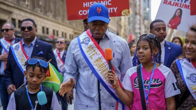 Mayor Eric Adams cuts the ceremonial ribbon and marches in the 60th Annual Hispanic Heritage Parade Sunday, October 13, 2024.