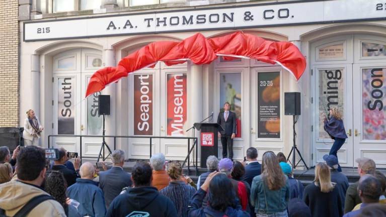 Raising the curtain on the A.A. Thomson &amp; Co. warehouse rededication.