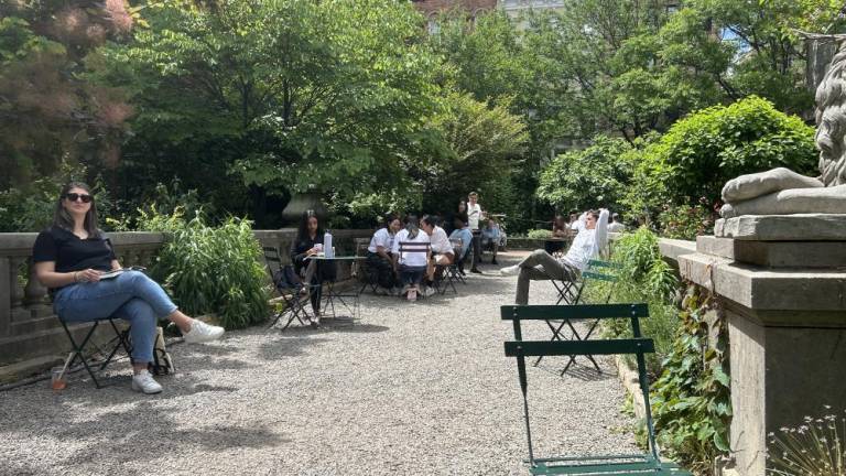 Locals take in the sun at the Elizabeth Street Garden in SoHo on May 29, 2024. Photo Credit: Alessia Girardin.