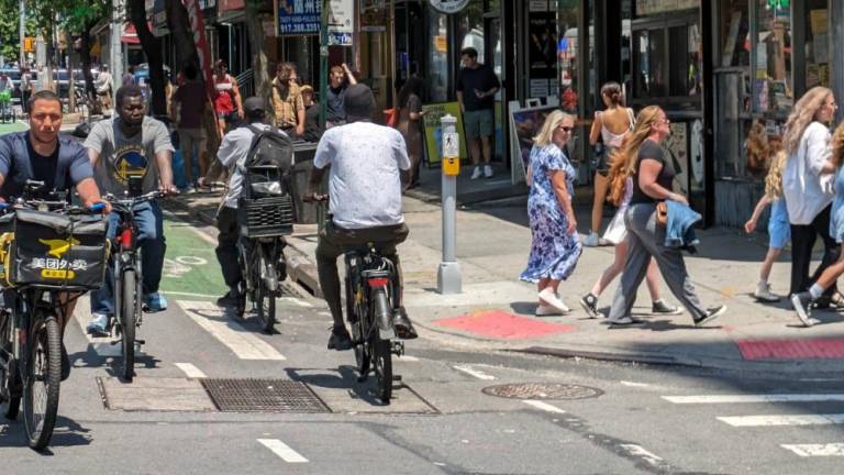 Anarchy on 9th Ave.: look both ways, four times, at least, to cross safely as e-bike routinely drive the wrong way down bike lanes and run red lights.