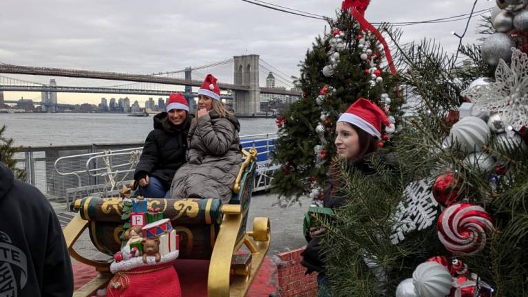 Photo op sleigh with the Brooklyn Bridge as a backdrop at the Winter Wonderland at Pier 15, Sunday Dec. 15.