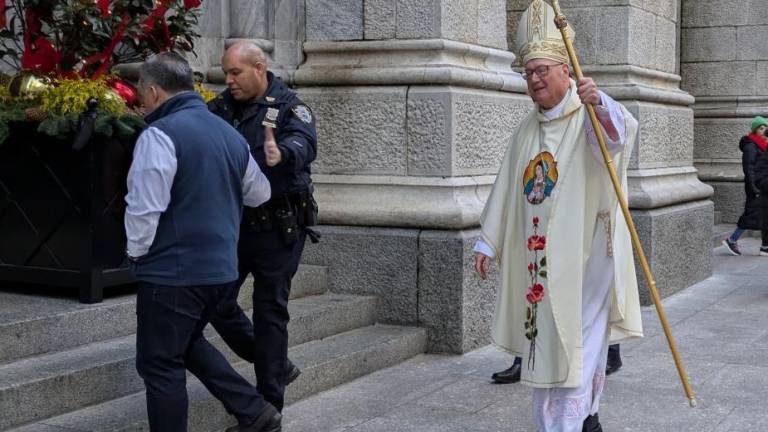 Cardinal Timothy Dolan entering St. Patrick’s Cathedral, Dec. 12, 2024 after greeting the procession that started at the Church of Our Lady of Guadalupe and St. Bernard at 328 W. 14th St. in the West Village and reached the cathedral in mid-town three hours later.