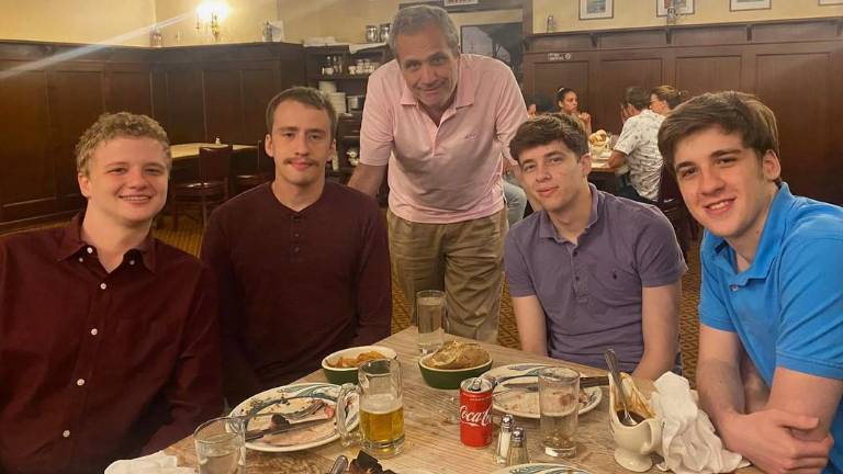 The Ferrari family at a Father’s Day celebration at Peter Luger Steak House in 2021, with Robert Ferrari (center) surrounded by his four sons (from left) Kevin, Matthew, Brian, and Peter.